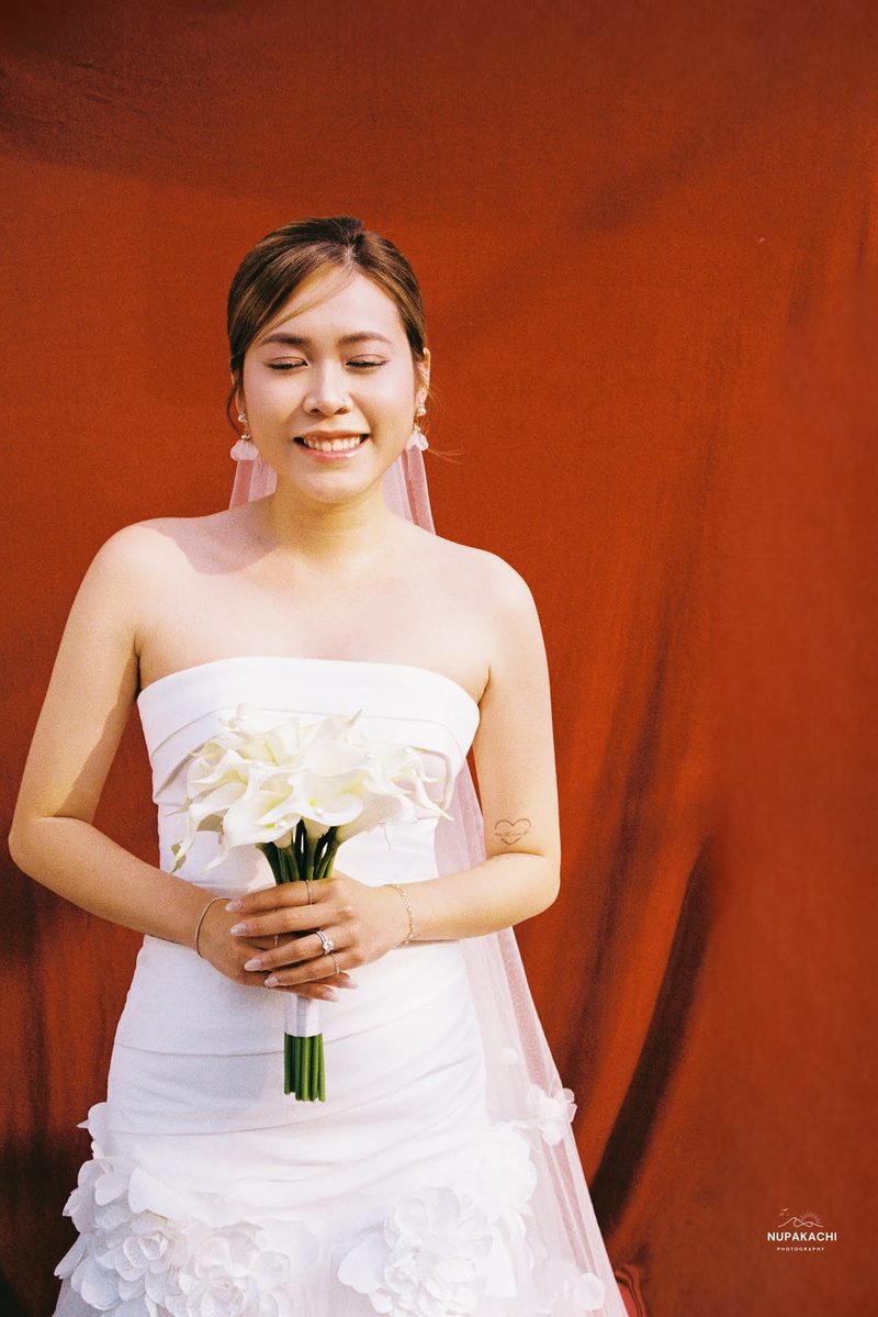 Bride and groom in red ao dai, Hong Kong vintage pre-wedding in Cholon on 35mm film (frame 2 of 12)