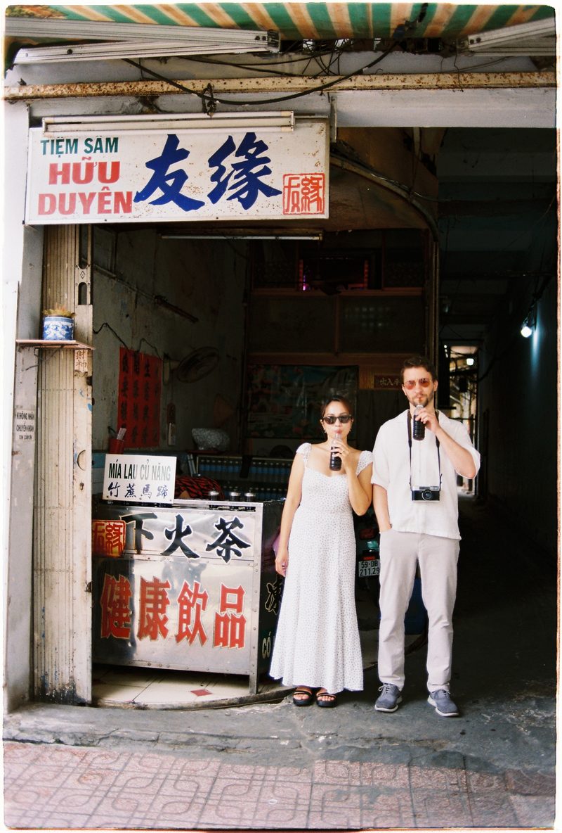 Couple in linen on the streets of District 5, Saigon, on 35mm film (frame 6 of 6)