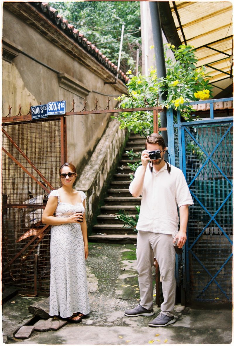 Couple in linen on the streets of District 5, Saigon, on 35mm film (frame 4 of 6)