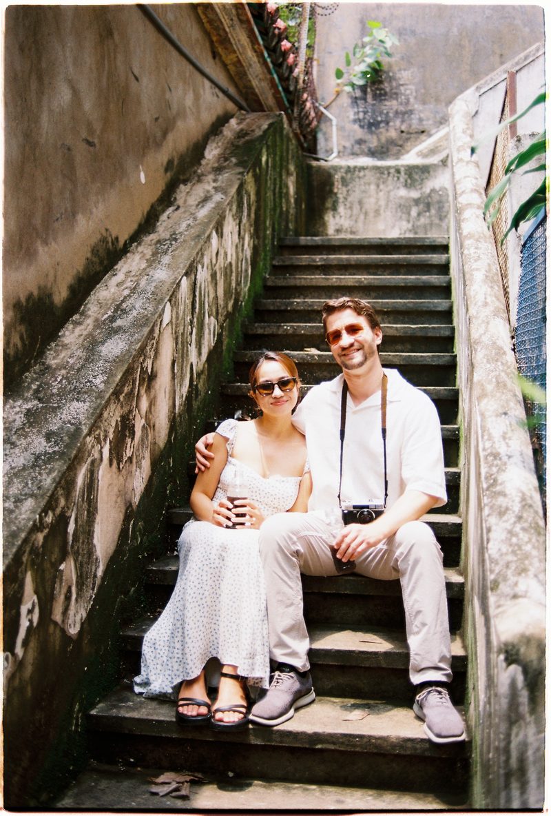 Couple in linen on the streets of District 5, Saigon, on 35mm film (frame 5 of 6)