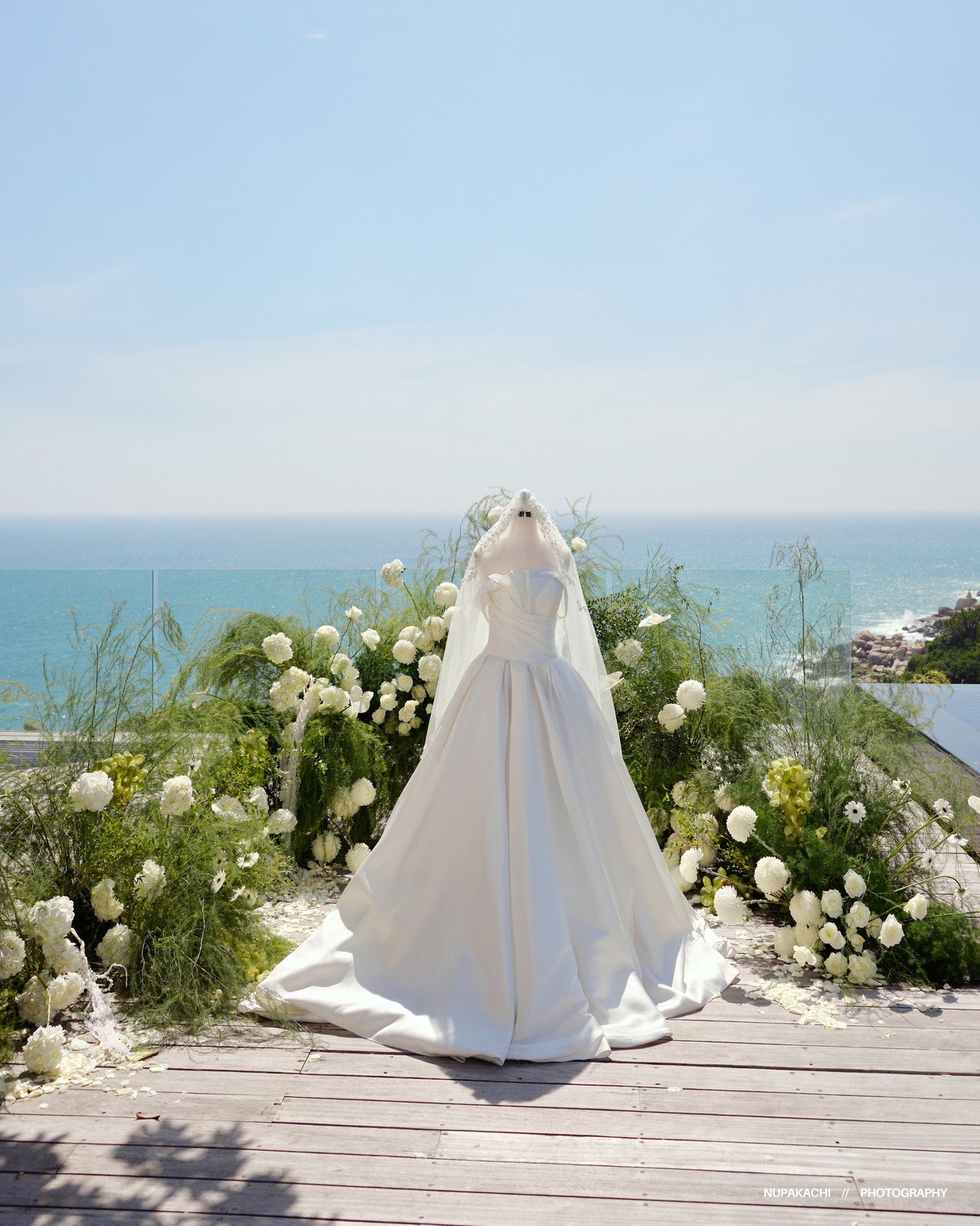 Wedding gown train flowing on a seaside walkway, fine art pre-wedding Vietnam