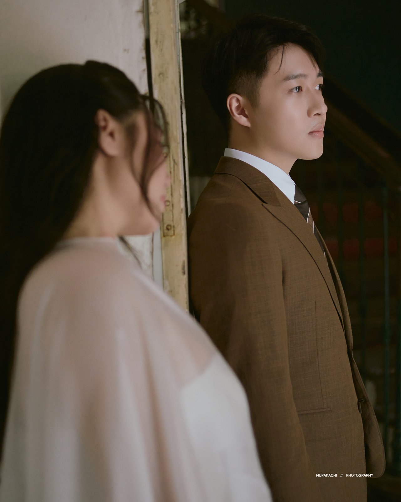Soft window light portrait of bride and groom, indoor studio pre-wedding Hanoi