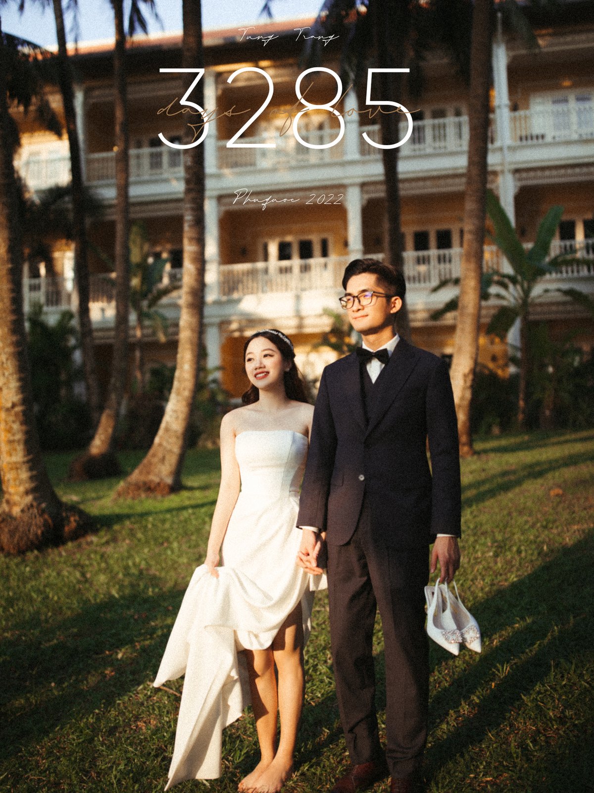 Couple walking on a resort lawn at golden hour, destination pre-wedding Vietnam