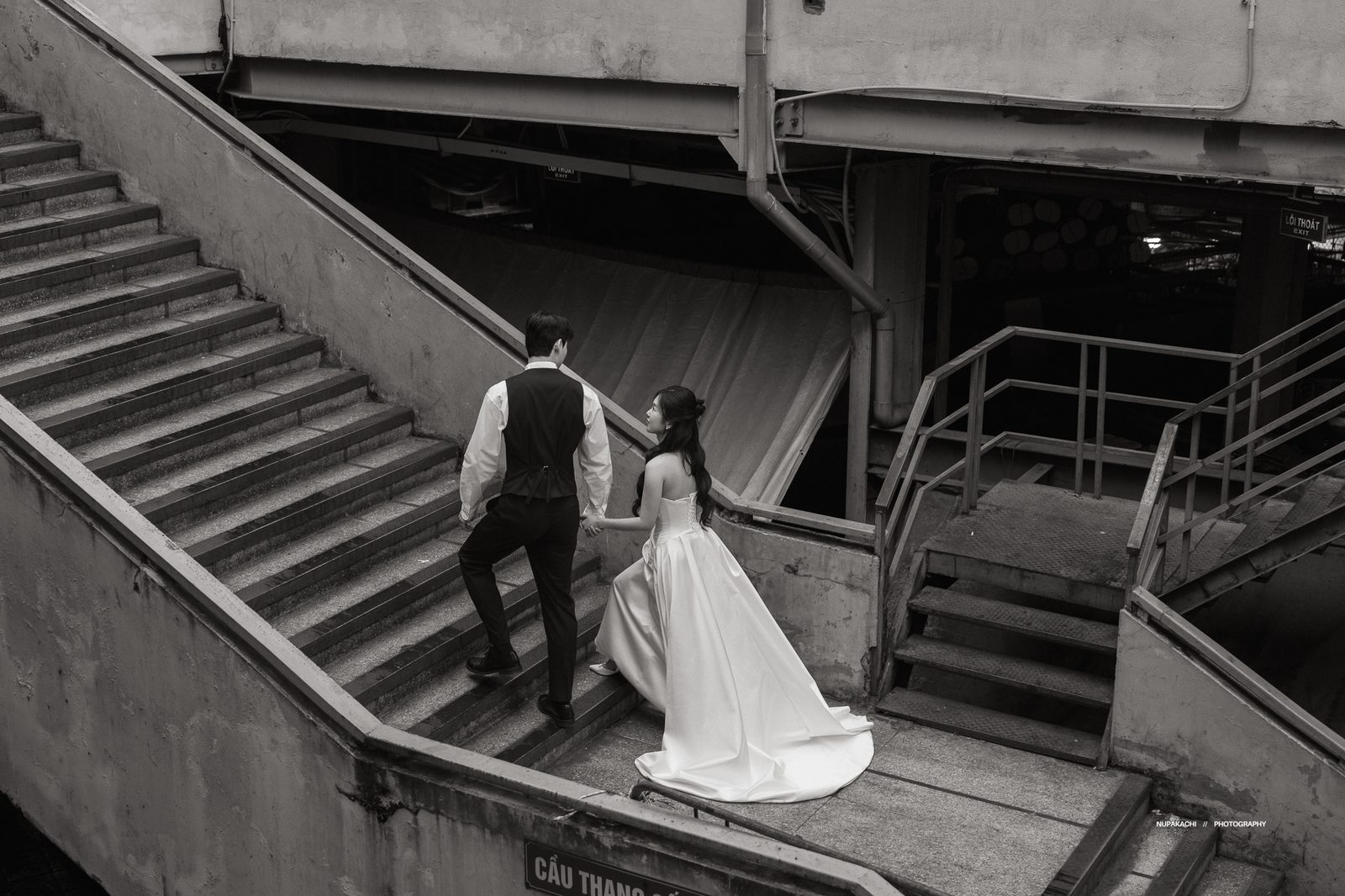 The stairwell of an old Hanoi apartment block, in black and white