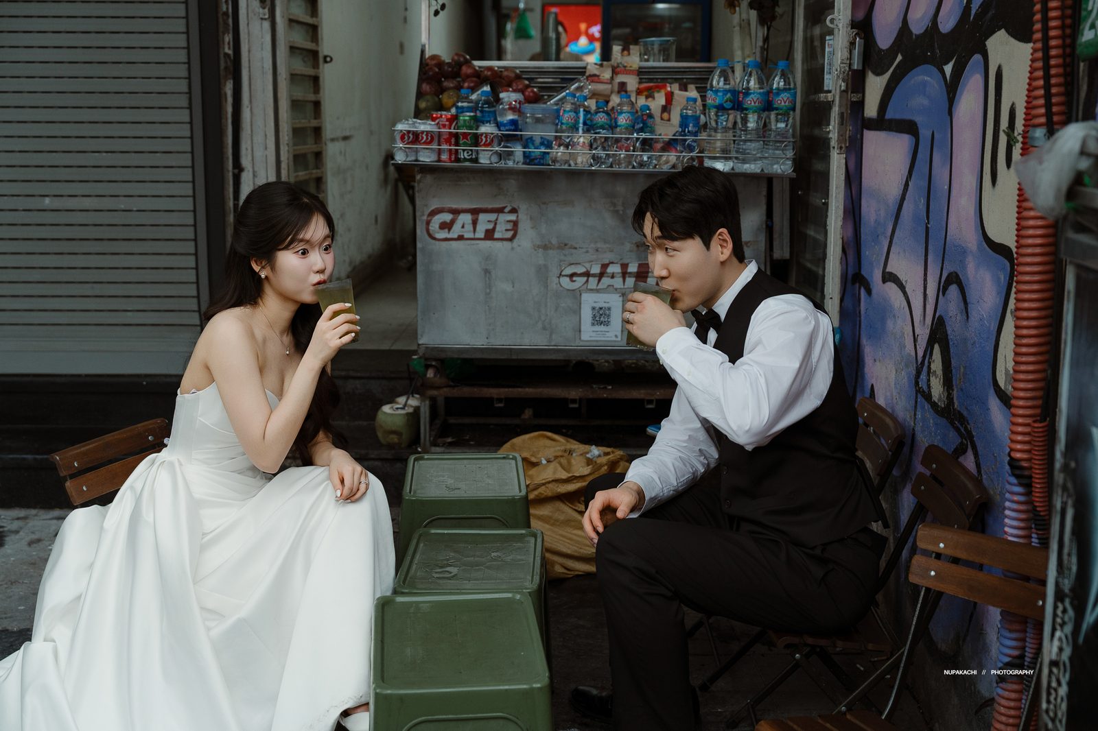 A drink on plastic stools at a pavement café in the Old Quarter