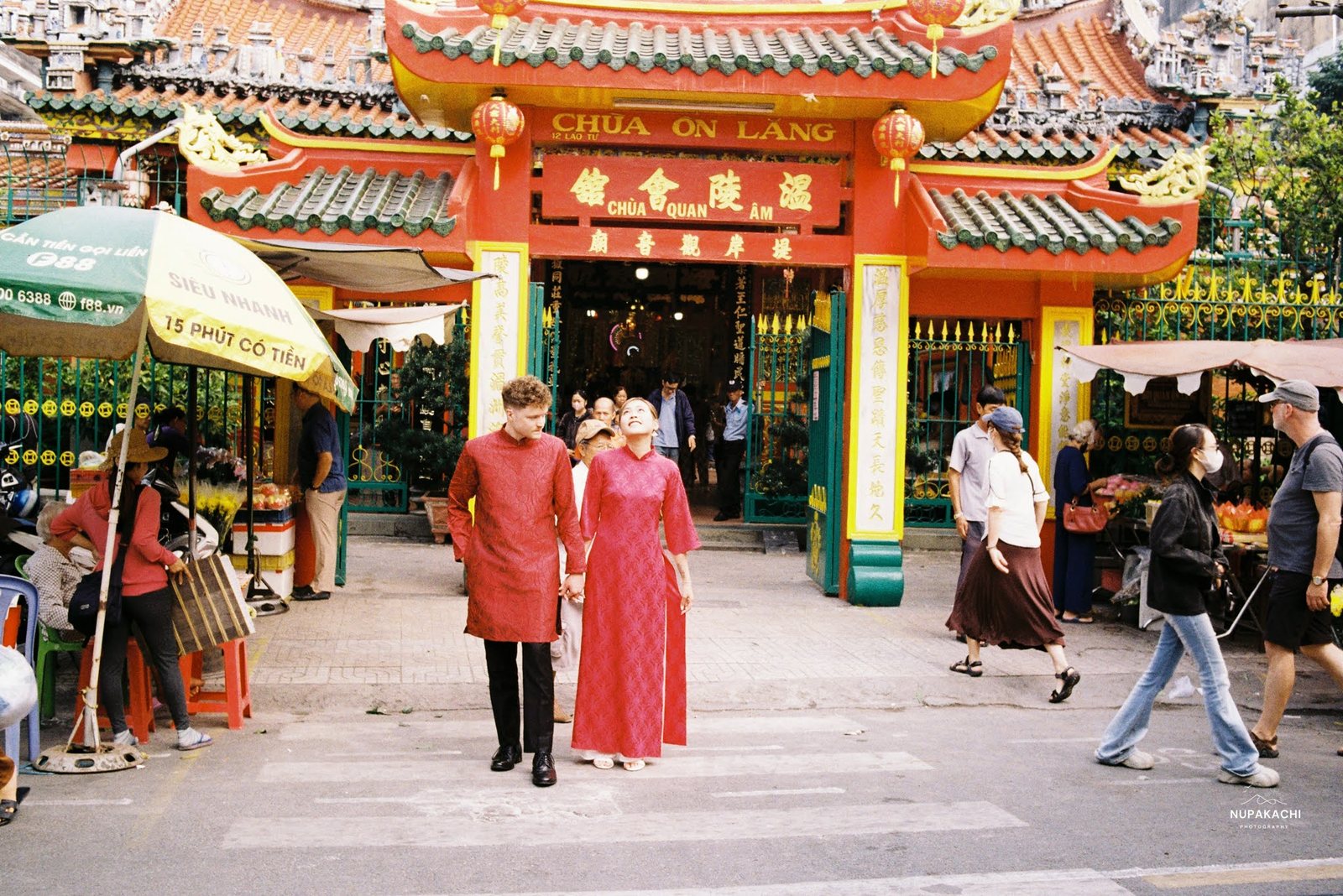 Red ao dai at the gate of Chua On Lang, Lao Tu Street, District 5