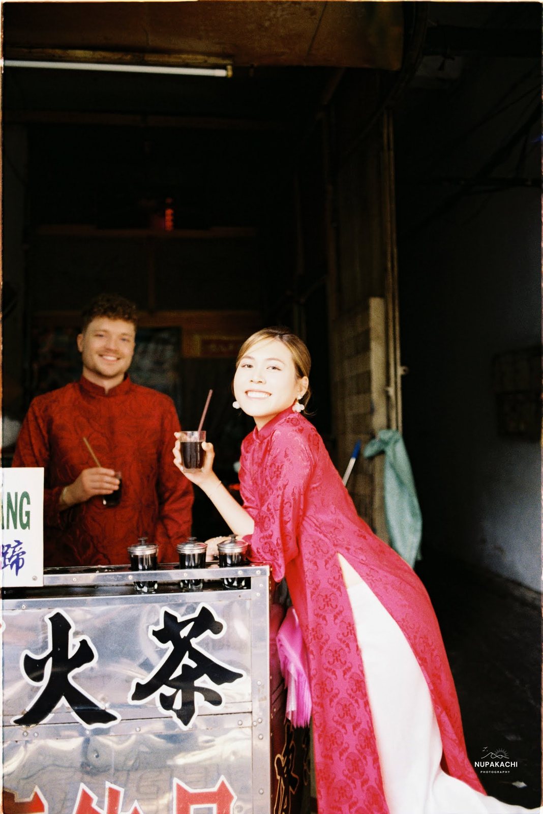 At a herbal tea stall under Chinese lettering