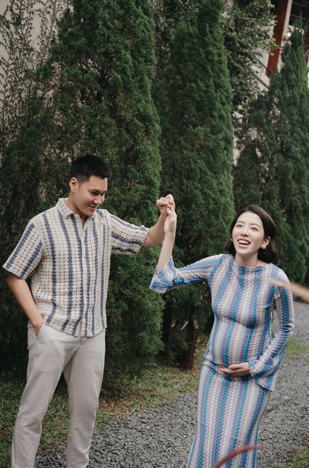 Returning couple dancing at their maternity session after their wedding, by Nupakachi