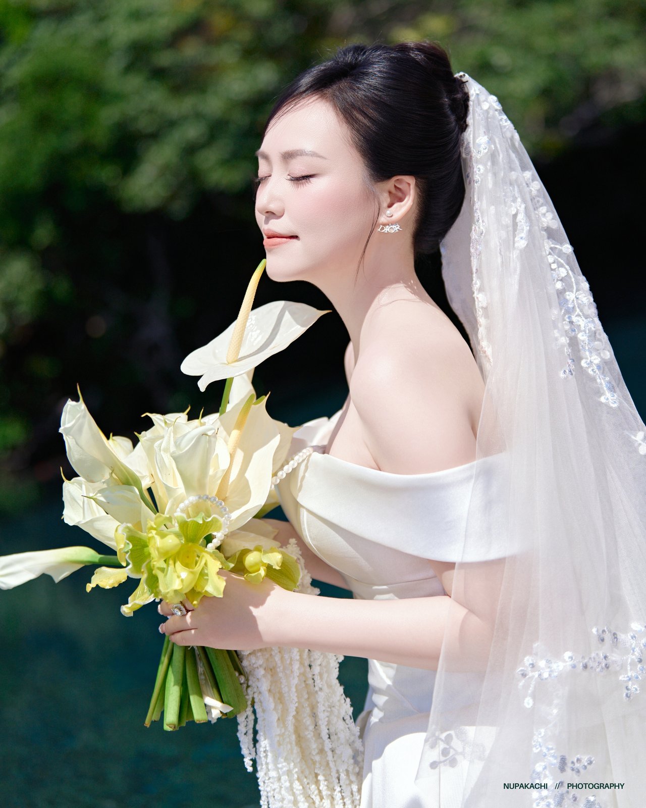 Minimalist bridal portrait with calla lilies, pre-wedding photography in Vietnam
