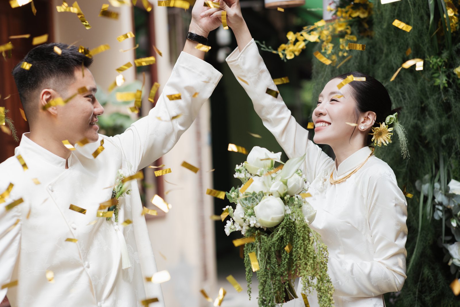 Golden confetti toast, candid wedding celebration photography Vietnam
