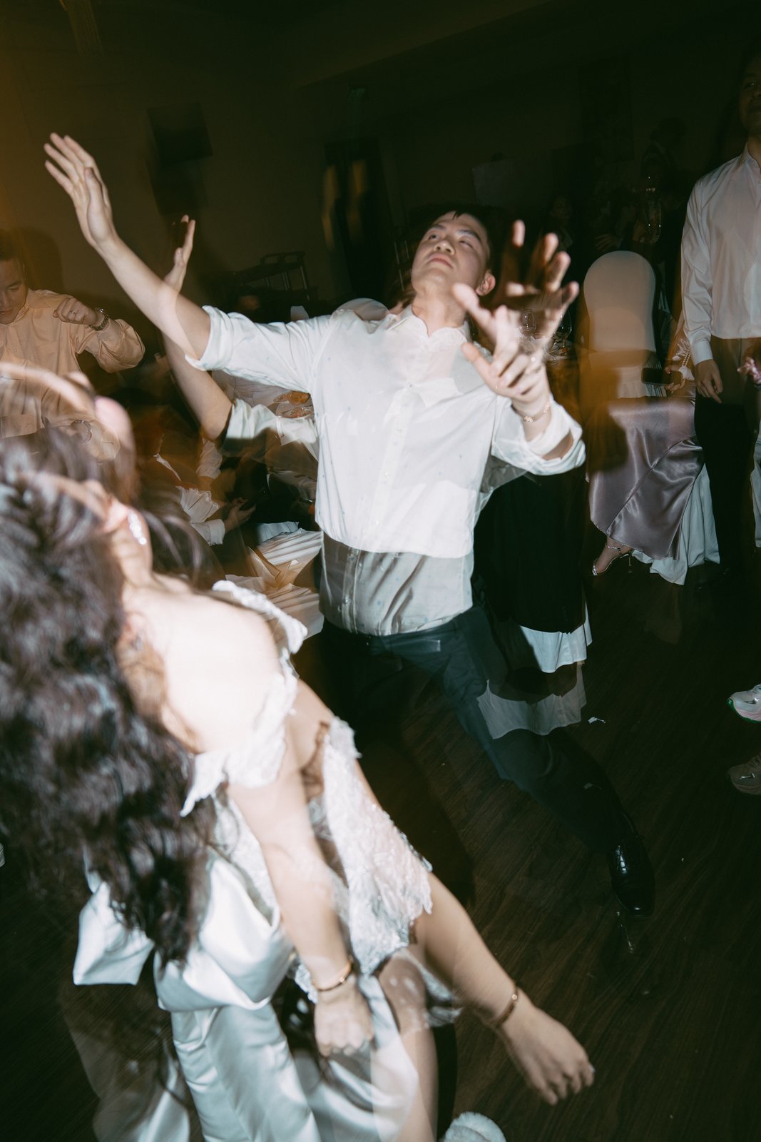 Dance floor celebration with flash photography at a Vietnam wedding party