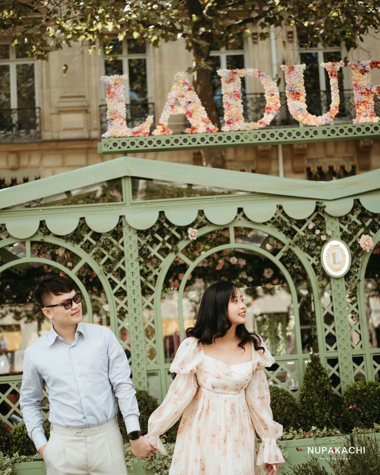Couple at Laduree Paris, elegant destination pre-wedding session