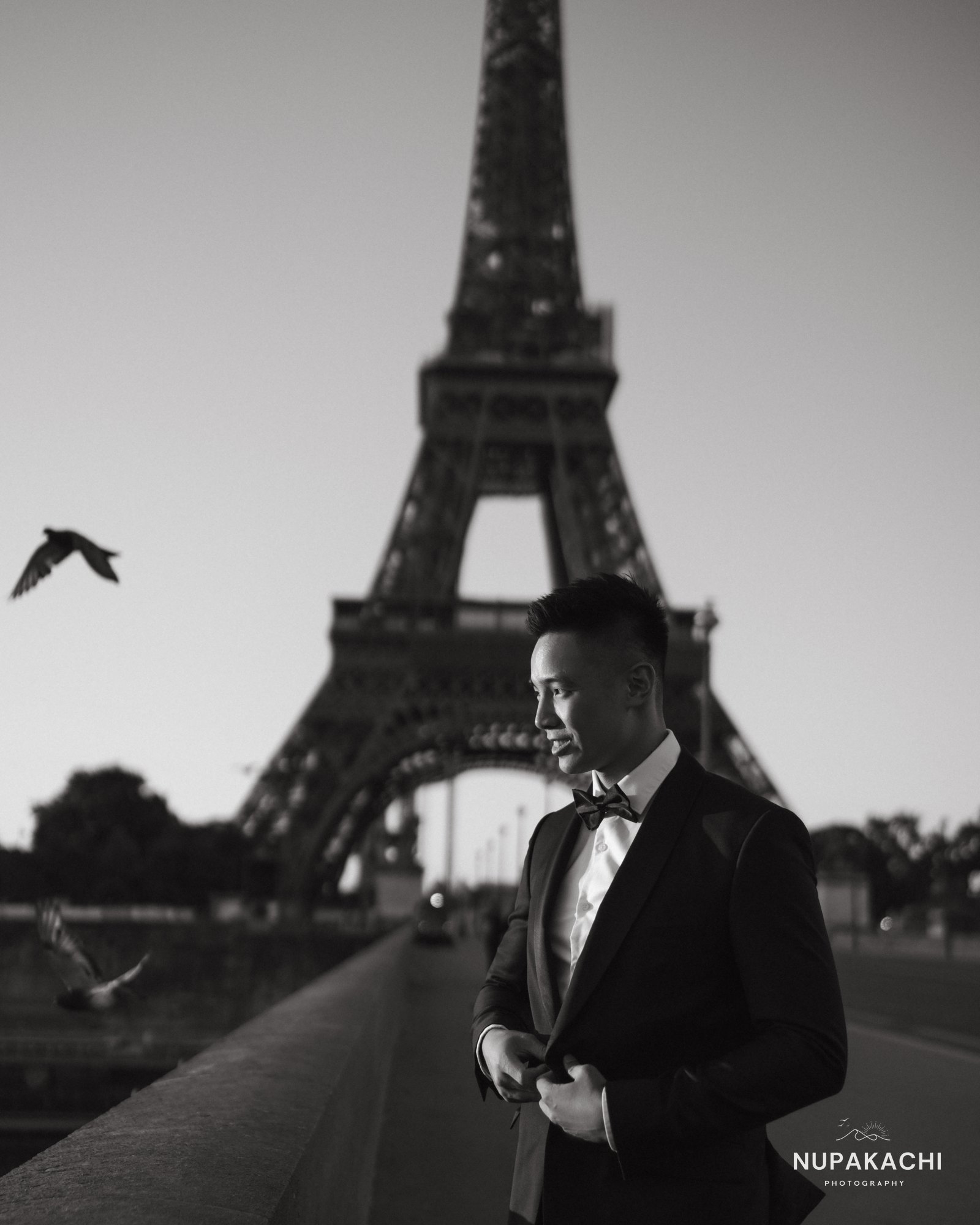 Groom in black tie before the Eiffel Tower, fine art Paris portrait