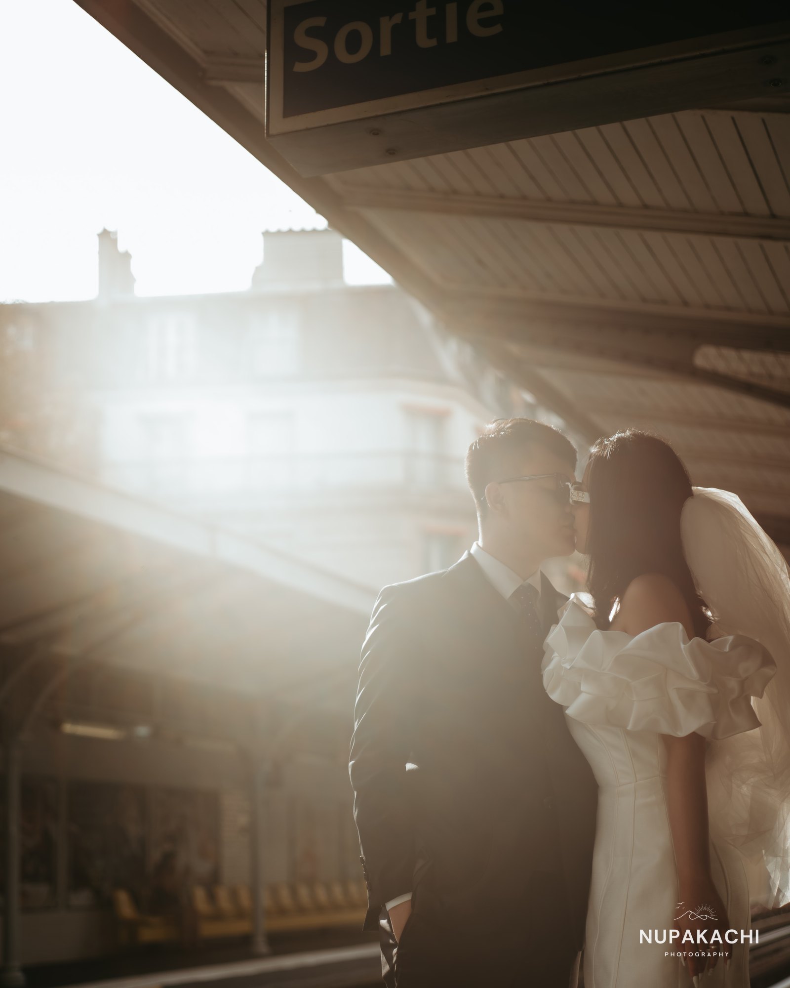 Sunlit Paris metro entrance moment, city pre-wedding photography
