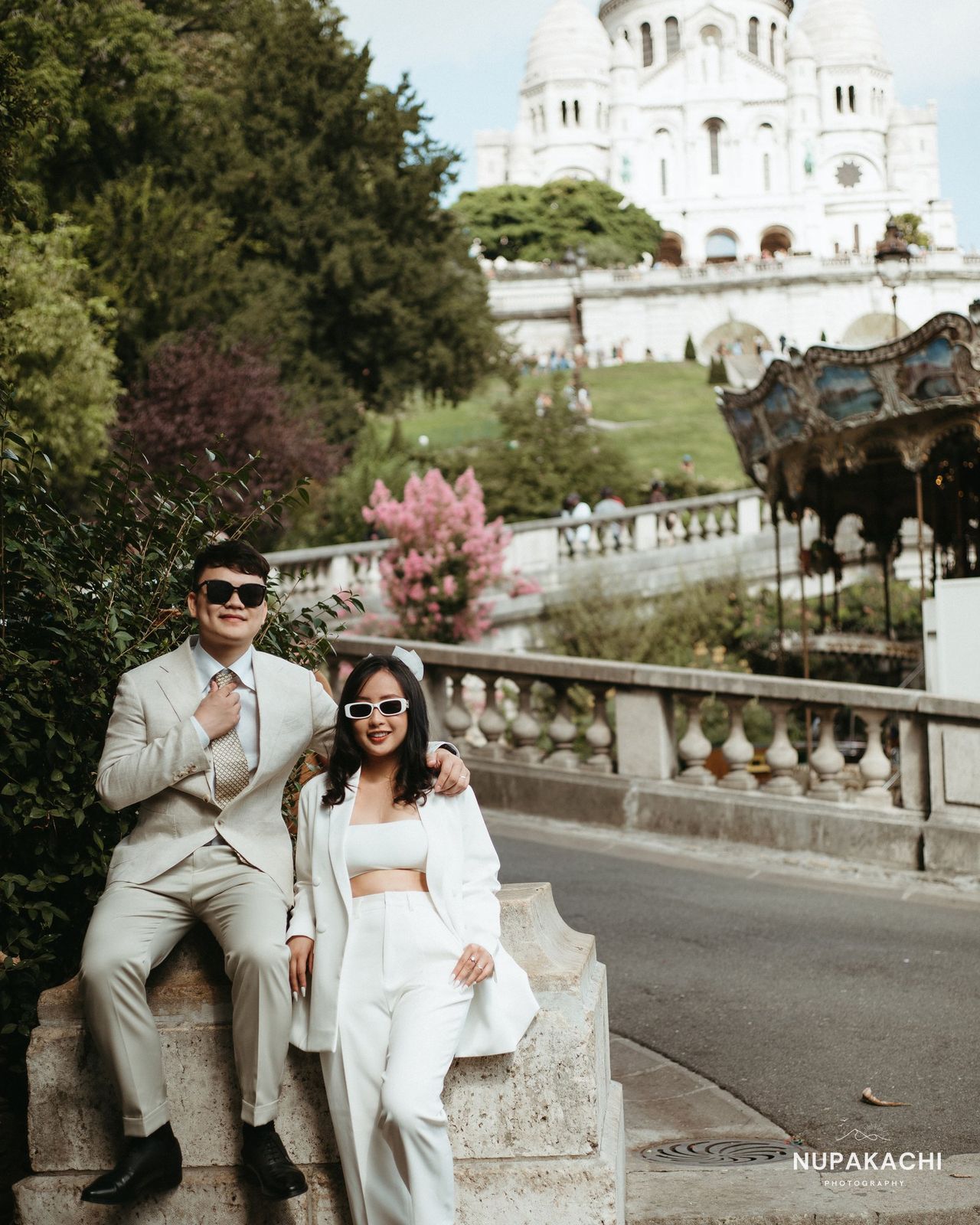 Sitting on the steps of Sacre Coeur, Montmartre pre-wedding Paris