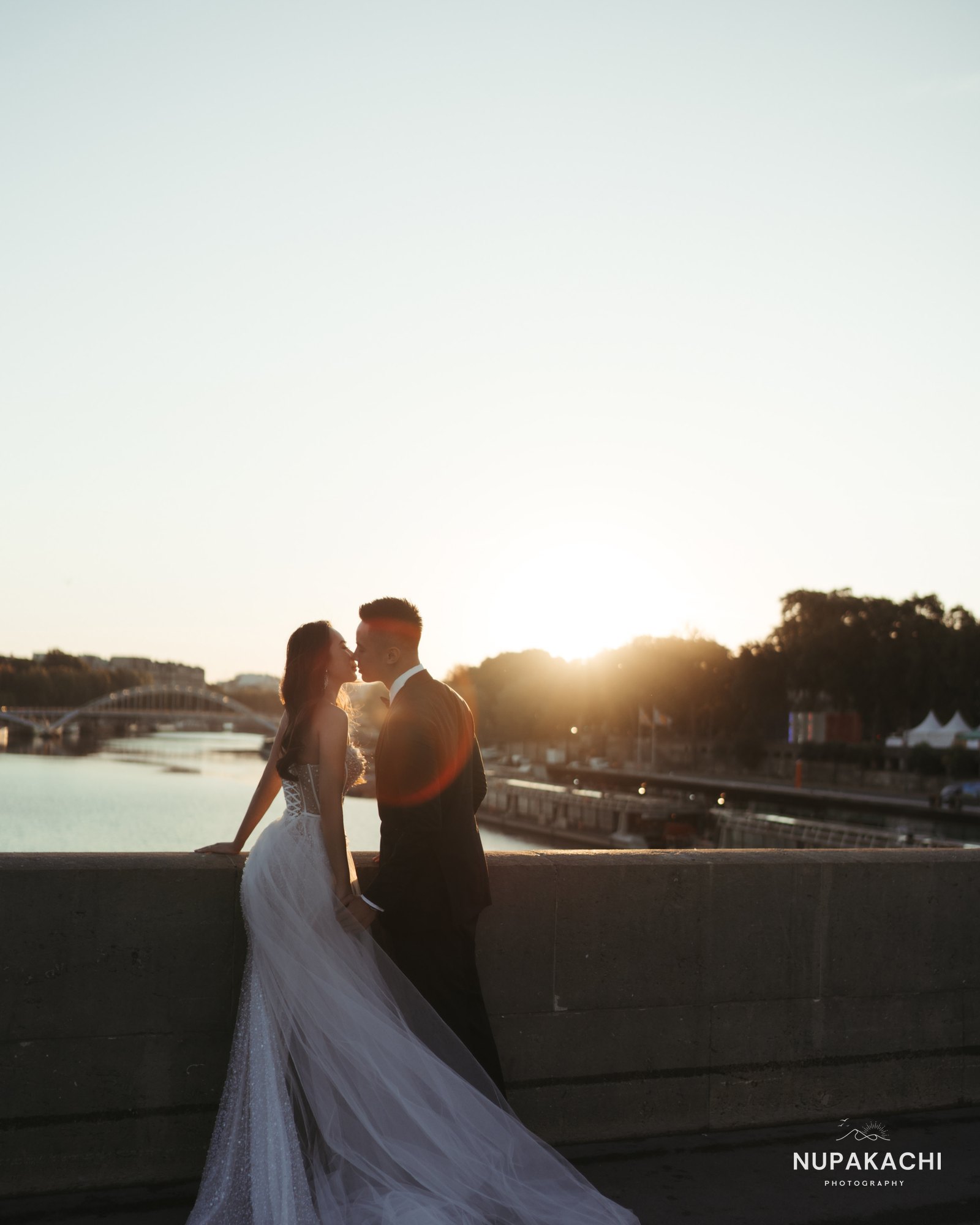 Sunset embrace by the Seine river, romantic Paris photography