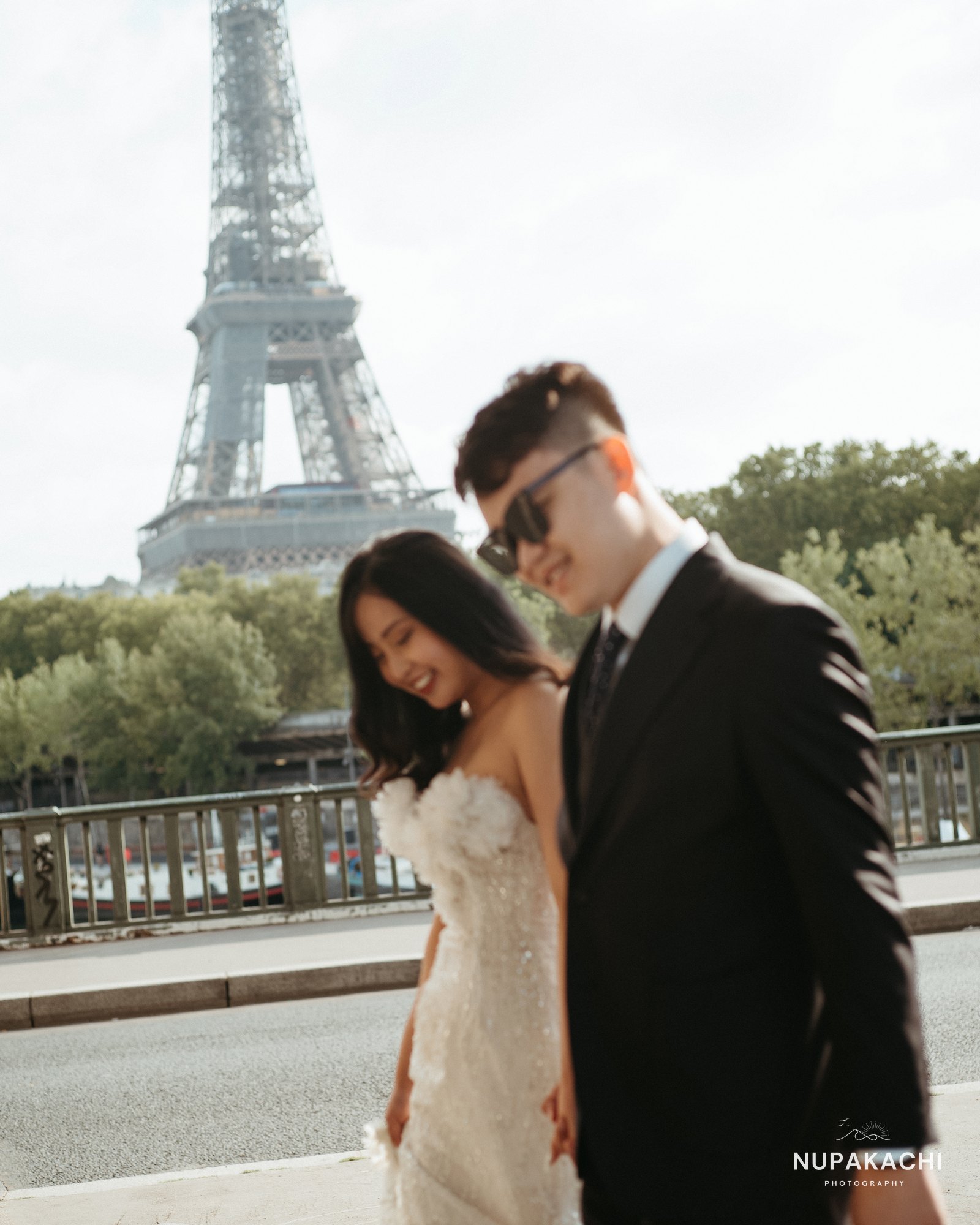 Walking by the Eiffel Tower, candid Paris destination session