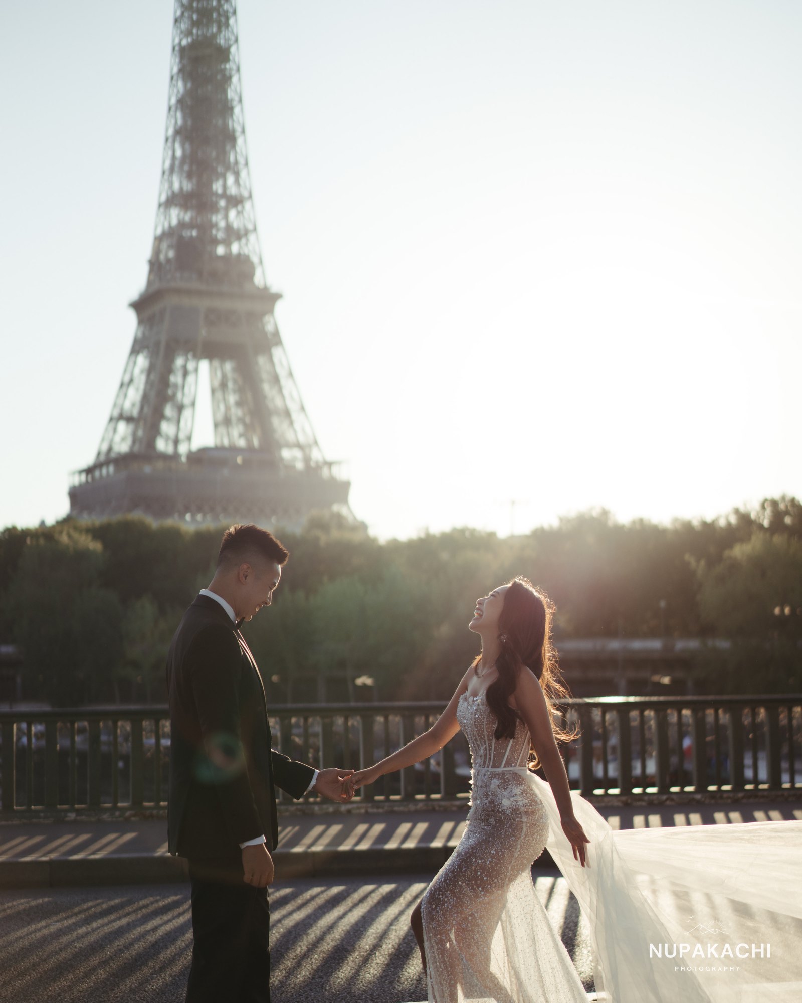 Eiffel Tower framing the couple at dusk, Paris wedding photographer