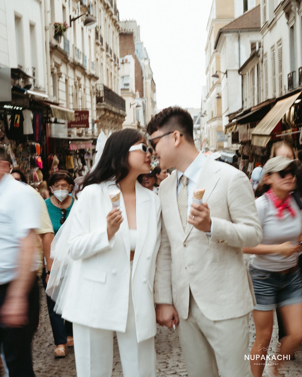 Paris street style portrait of the couple in white, city pre-wedding