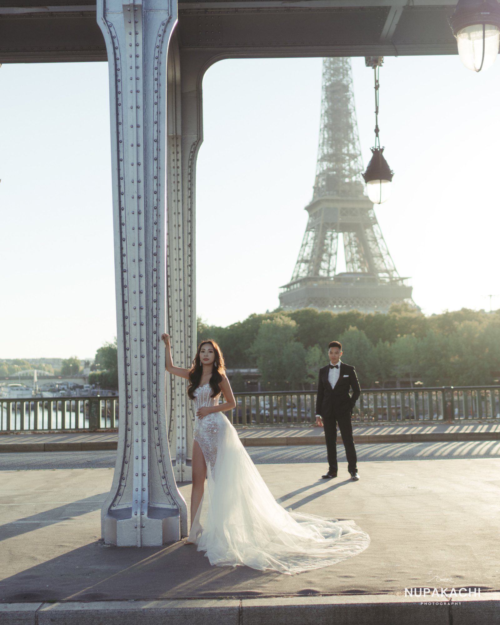 Bir Hakeim bridge portrait with trailing wedding gown, Paris
