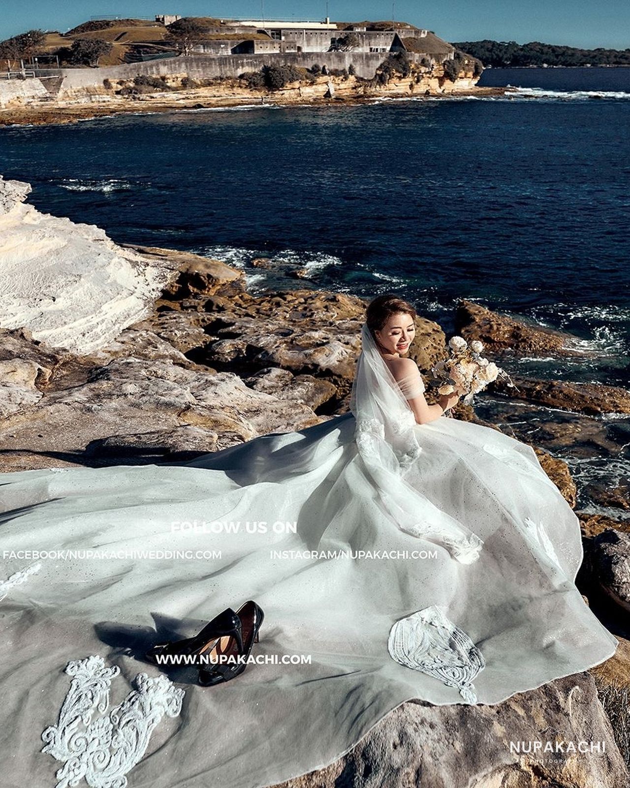 Wedding gown train over the sea cliffs of Sydney, Australia