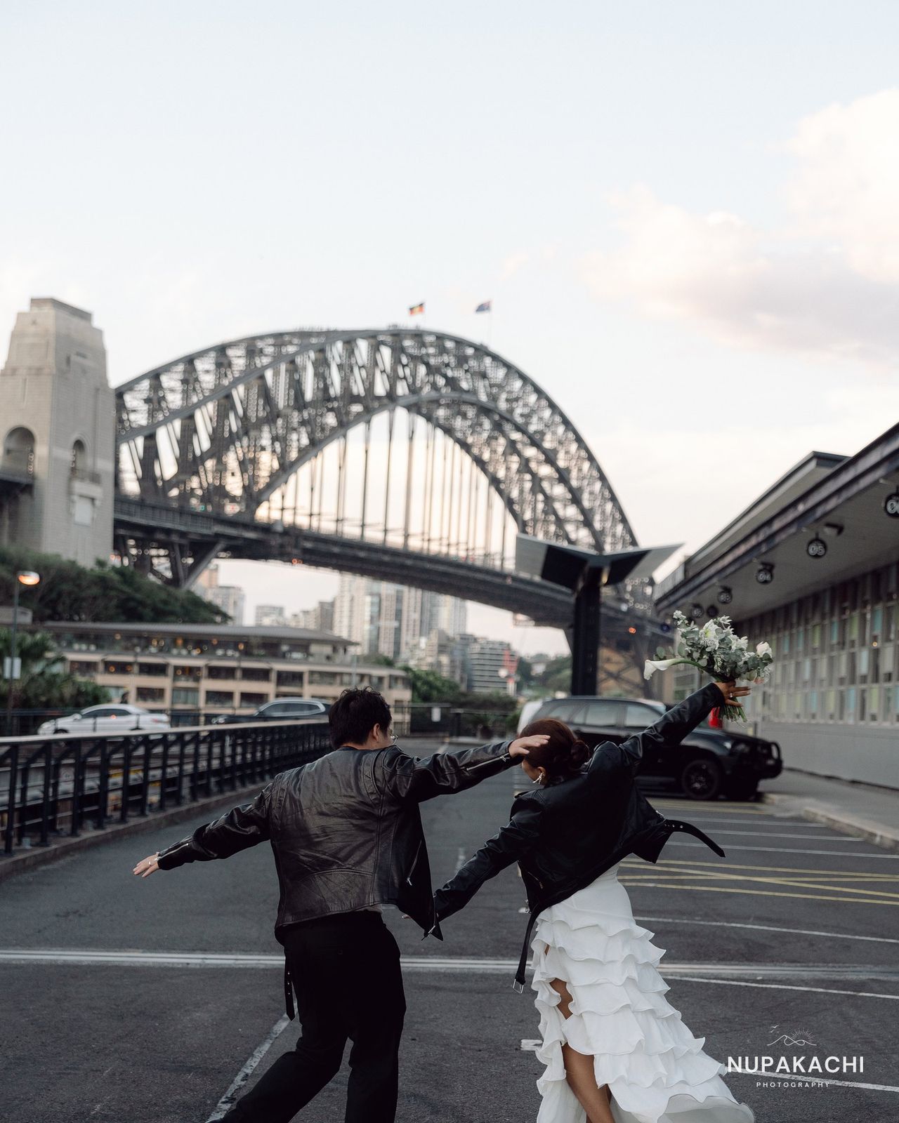 Running across the road before Sydney Harbour Bridge, Australia