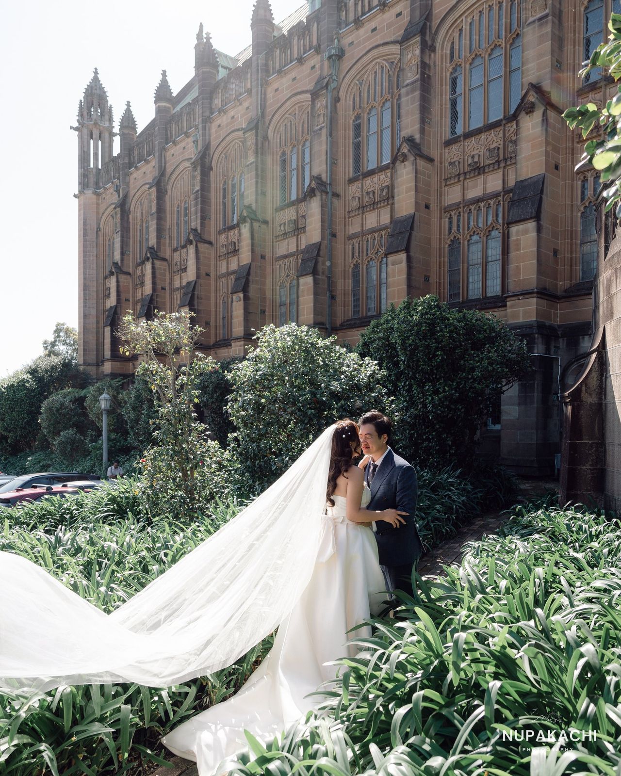 Wedding gown in front of gothic sandstone architecture, Sydney