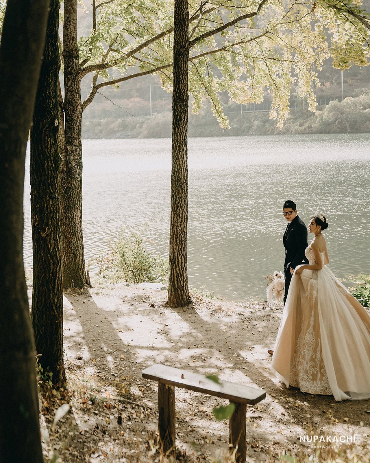Lakeside forest in autumn with wedding gown, destination pre-wedding